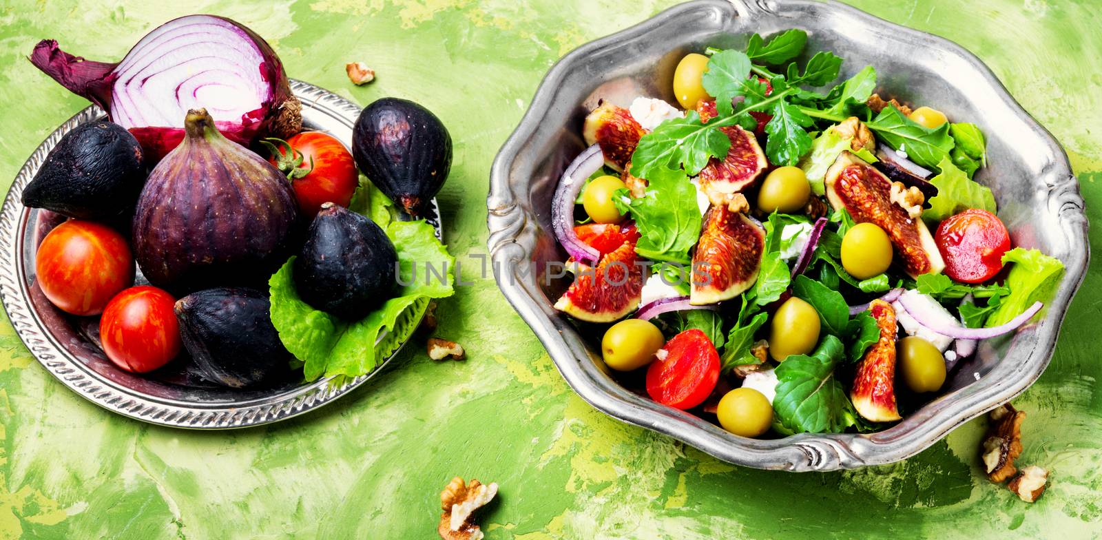 Autumn salad with arugula,olive, figs and cheese.Healthy food