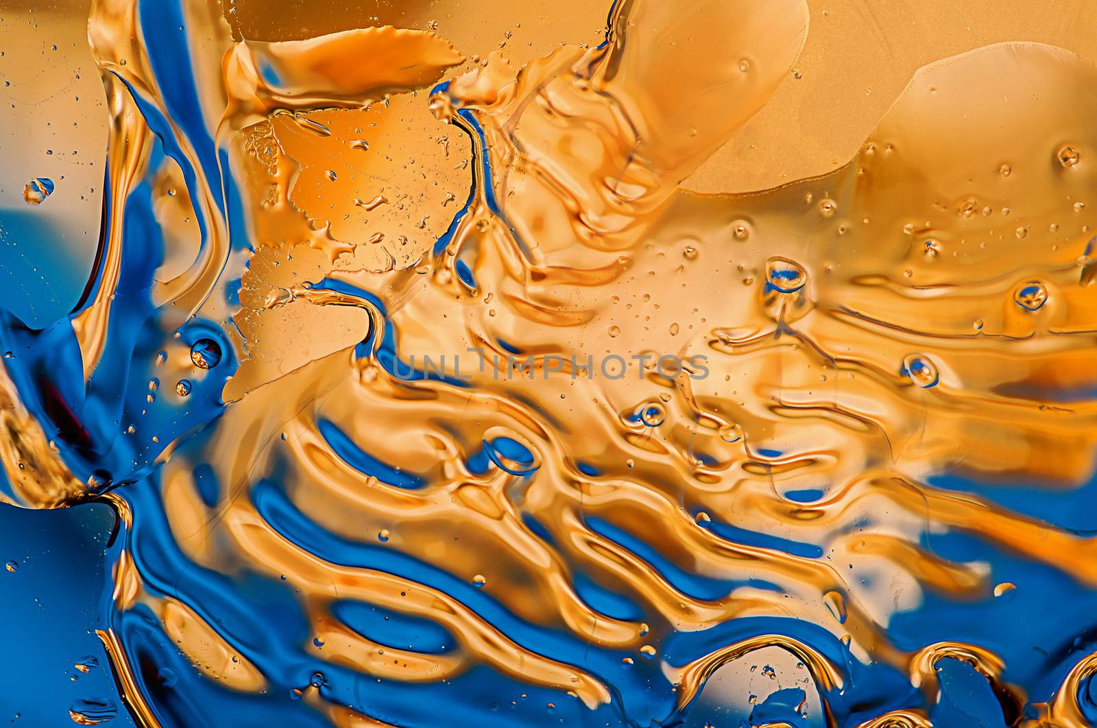 Abstract yellow-blue background. Smooth stains from oil and water.