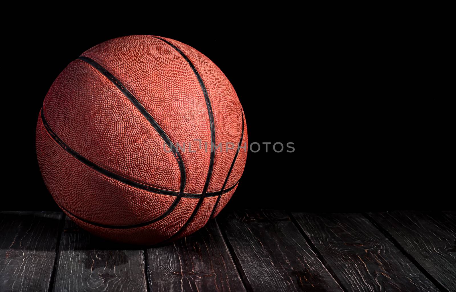 Basketball ball on a wooden floor by Cipariss