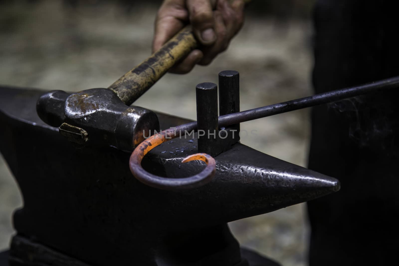 Iron incandescent in an old metal forge, industry detail