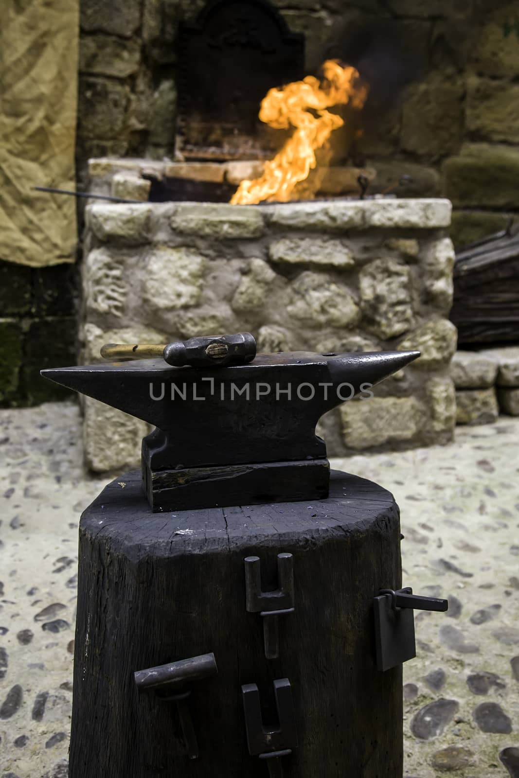 Iron incandescent in an old metal forge, industry detail
