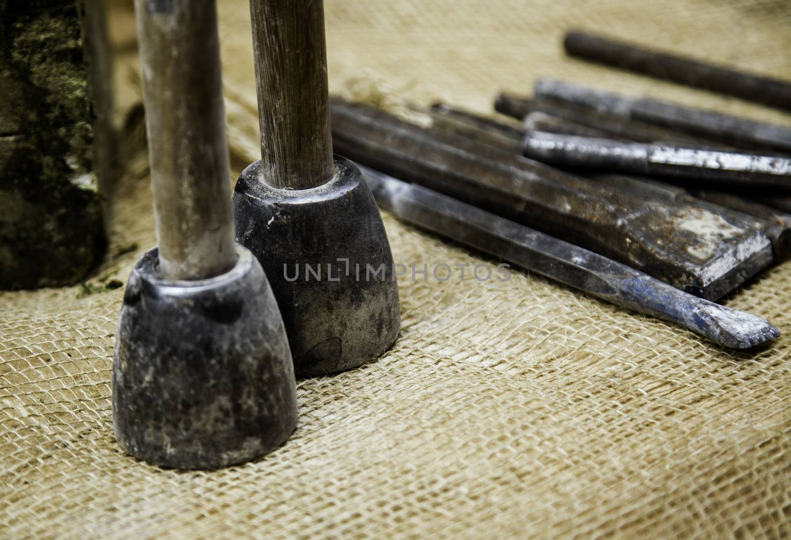 Old tools for carving stone of handmade way, detail of old manual craft