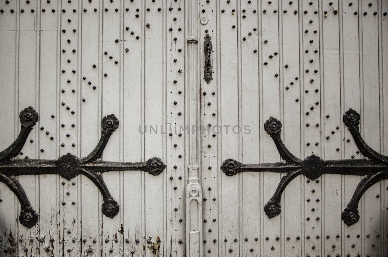 Old wooden door with metal, medieval door detail, decoration and security