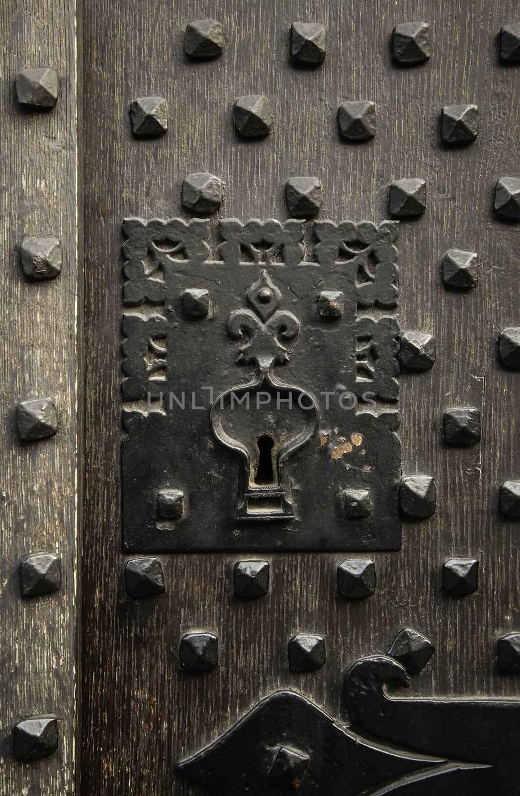 Ancient decorated metallic lock, detail of security and decoration