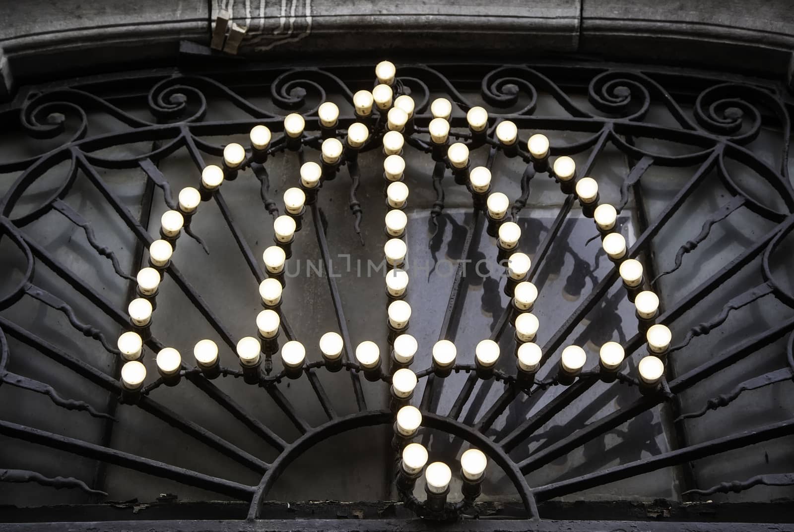 Umbrella of light bulbs, illuminated symbol detail