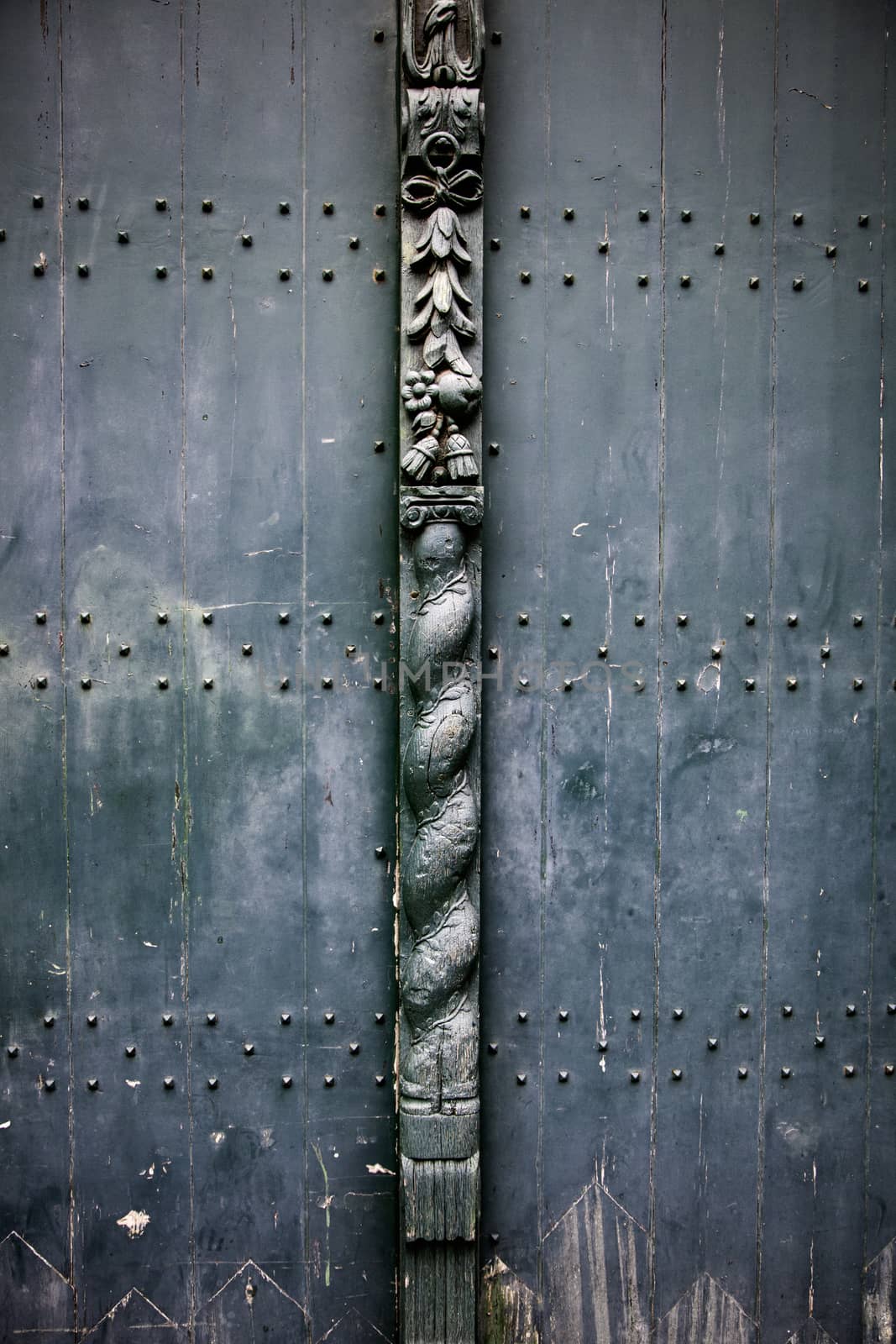 Old wooden door with metal, medieval door detail, decoration and security