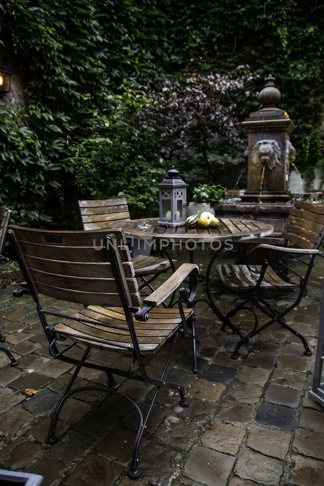 Garden table with pumpkins, decorated terrace detail of halloween