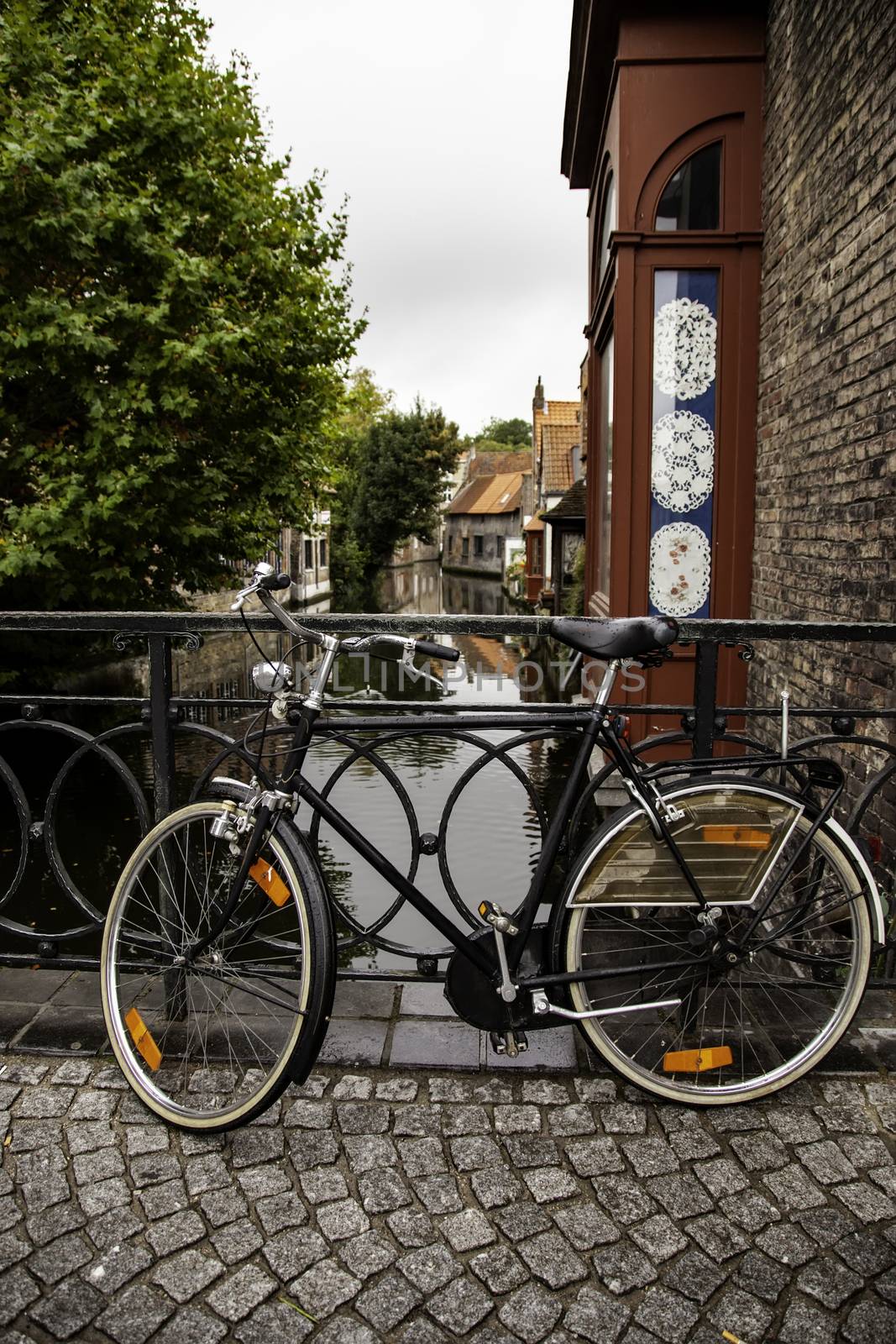 Typical bicycle in Bruges, detail of transport in town, tourism and exploration of the city