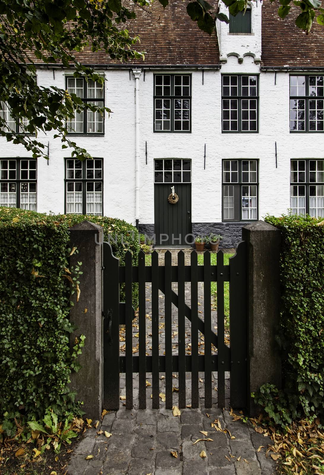 Begijnhof, typical and old district of Bruges, detail of typical Belgian house, tourism in Europe