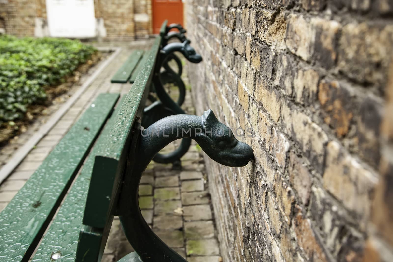 Old bench to sit, bench decorated with mythological animals