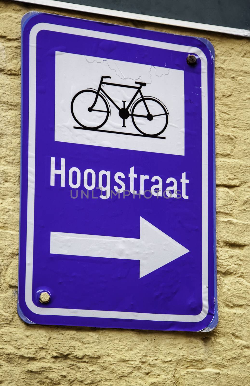 Bicycle sign with arrow, detail of information, transport