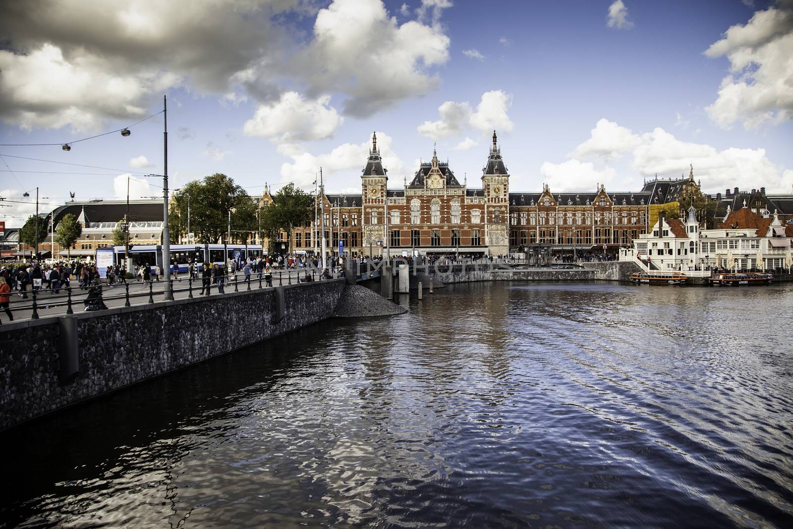 AMSTERDAM, NETHERLAND - SEPTEMBER 06, 2018, Central station building. The building of the Central station is one of the architectural attractions of the city, Netherland on September 06, 2018 by esebene