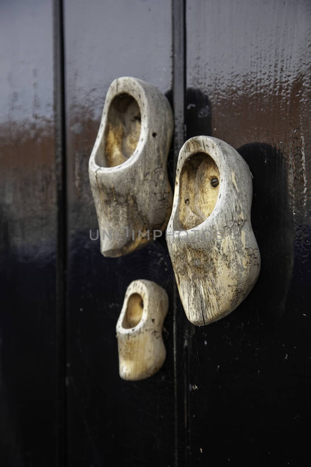 Dutch clogs craftsmen, manufacture of traditional footwear for the field