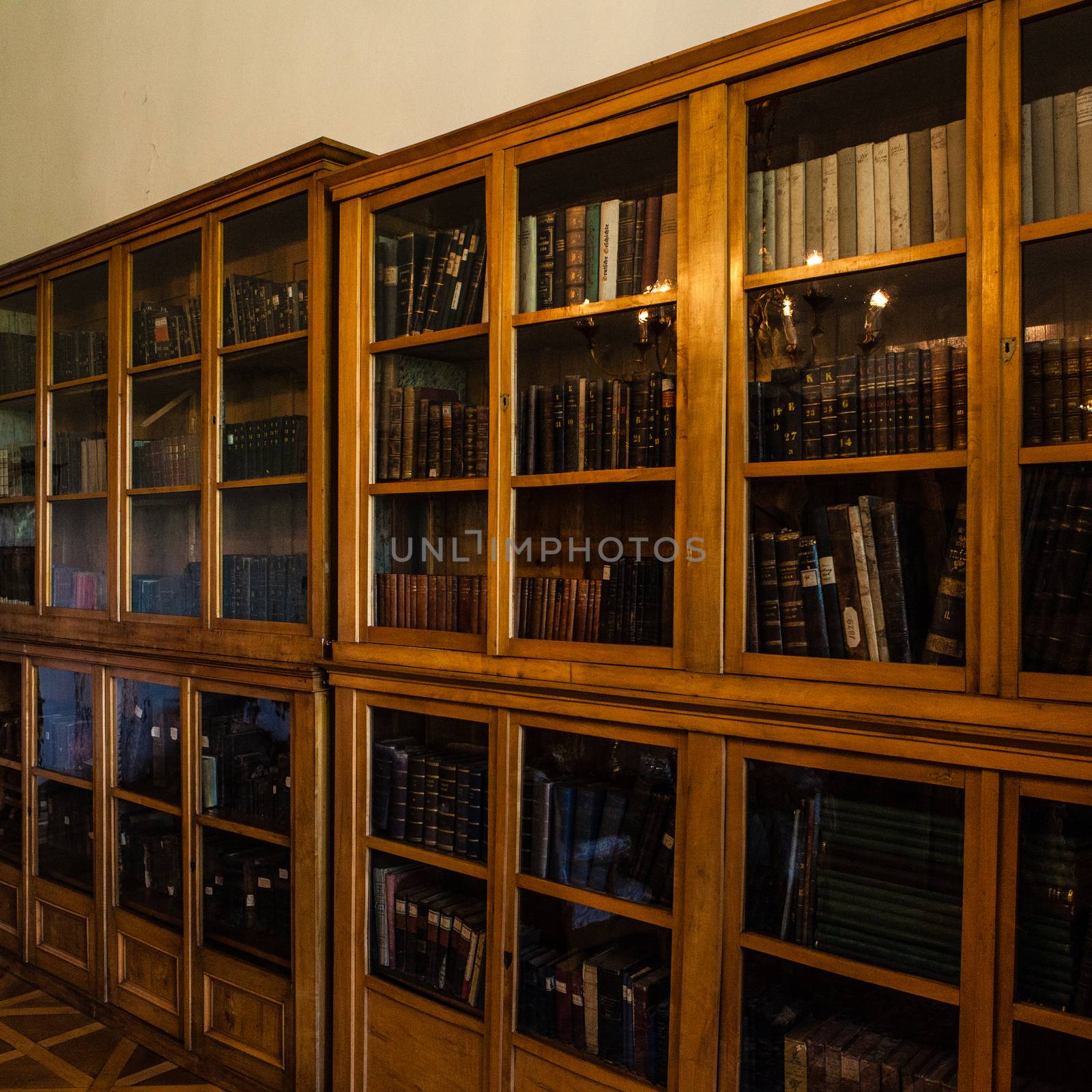 Old books in a wooden row library