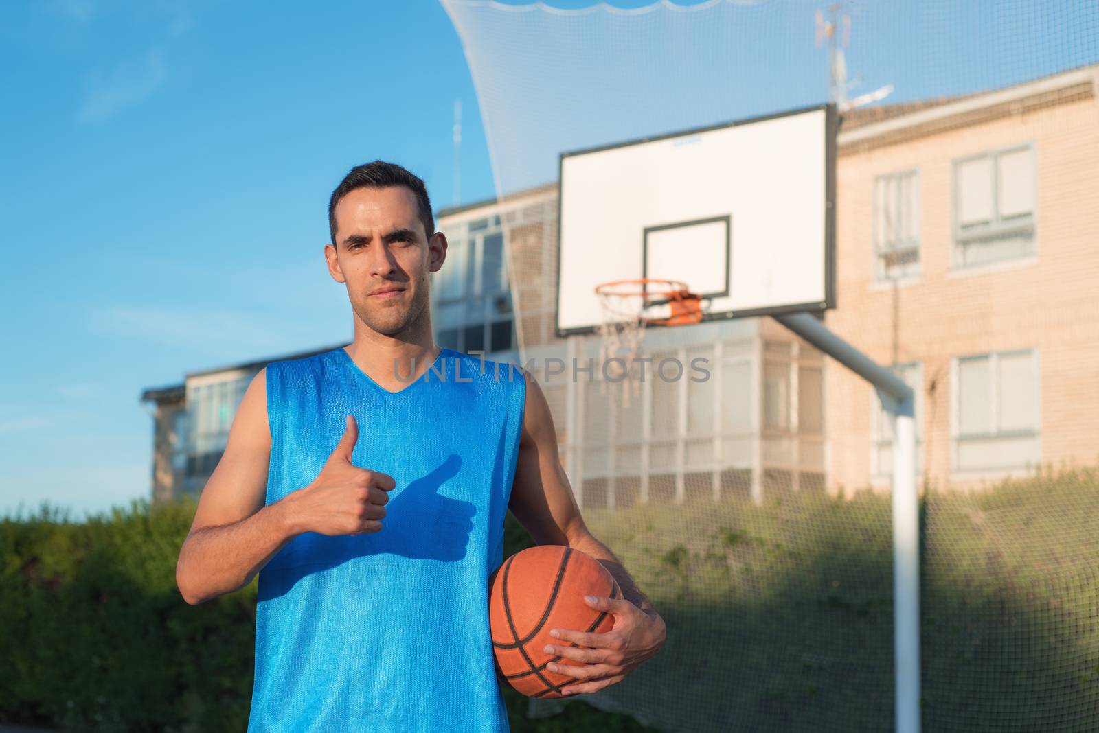 Basketball player with thumb up by HERRAEZ
