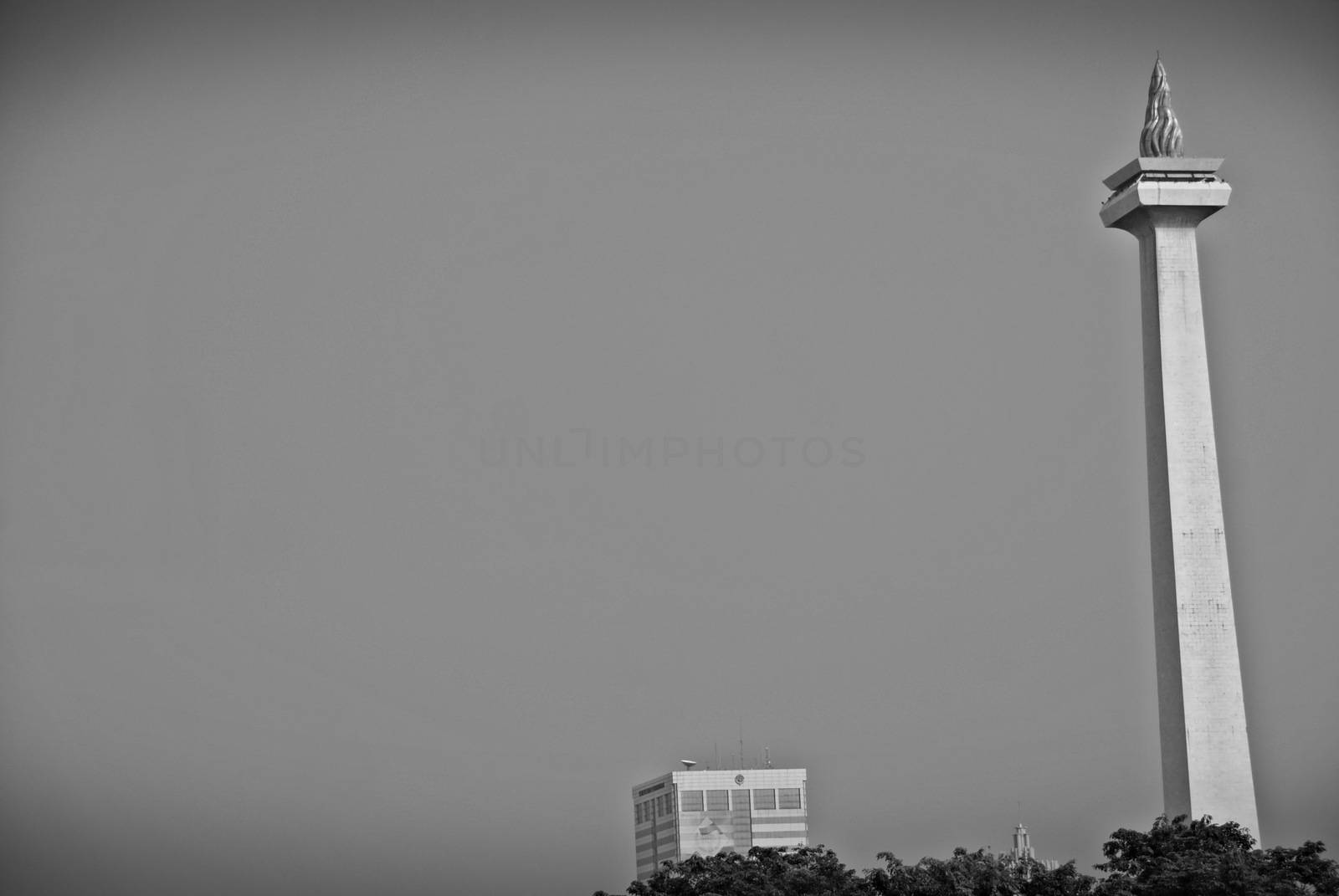 National Monument or MONAS (Monumen Nasional) seen from Gambir Train Station in Jakarta, Indonesia by craigansibin