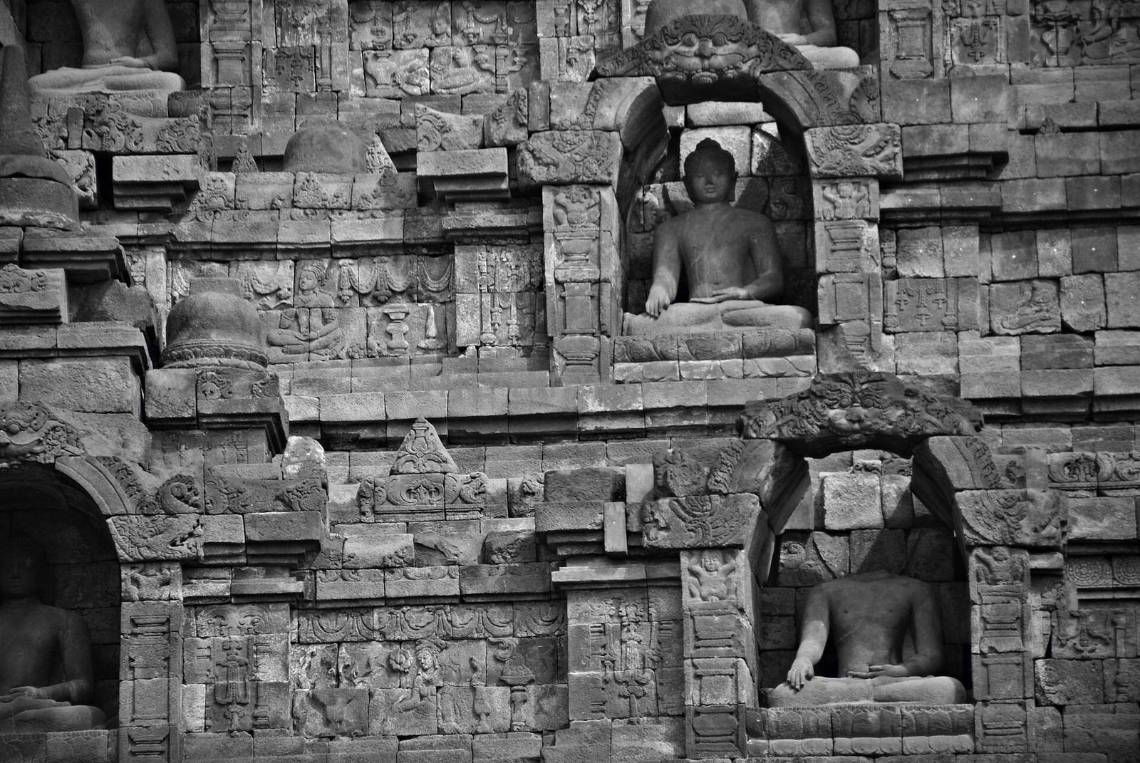 Image of sitting Buddha in Borobudur Temple, Jogjakarta, Indonesia by craigansibin