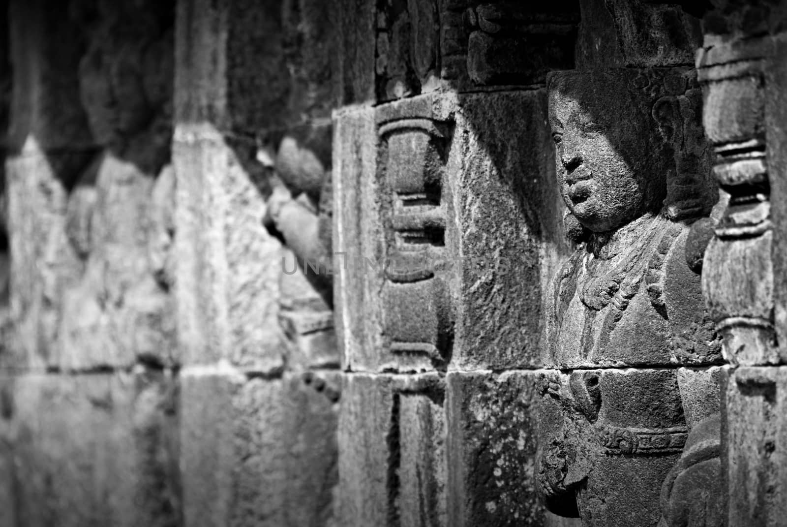 Relief or carvings on the wall of Borobudur Temple in Jogjakarta, Indonesia by craigansibin