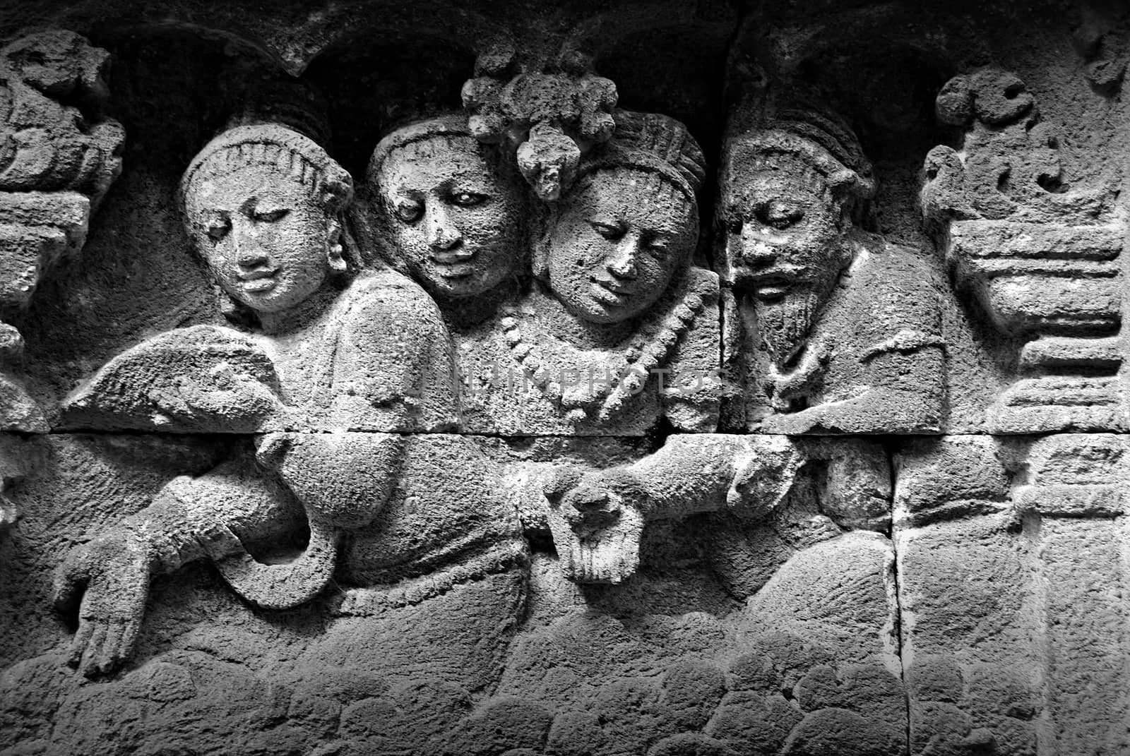 Relief or carvings on the wall of Borobudur Temple in Jogjakarta, Indonesia by craigansibin