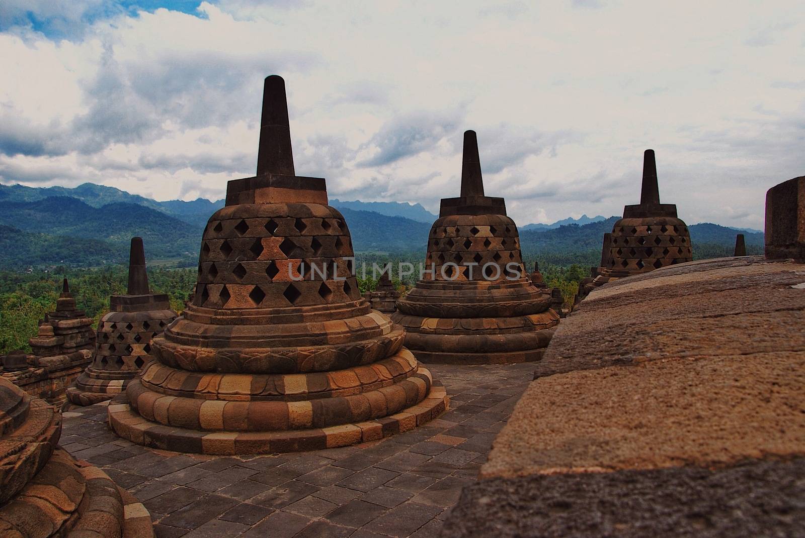 Around the circular platforms are 72 openwork stupas, each containing a statue of the Buddha. by craigansibin