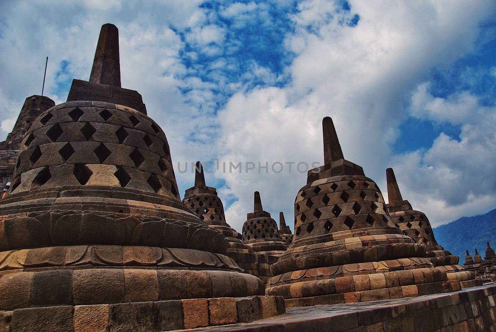 Around the circular platforms are 72 openwork stupas, each containing a statue of the Buddha. by craigansibin