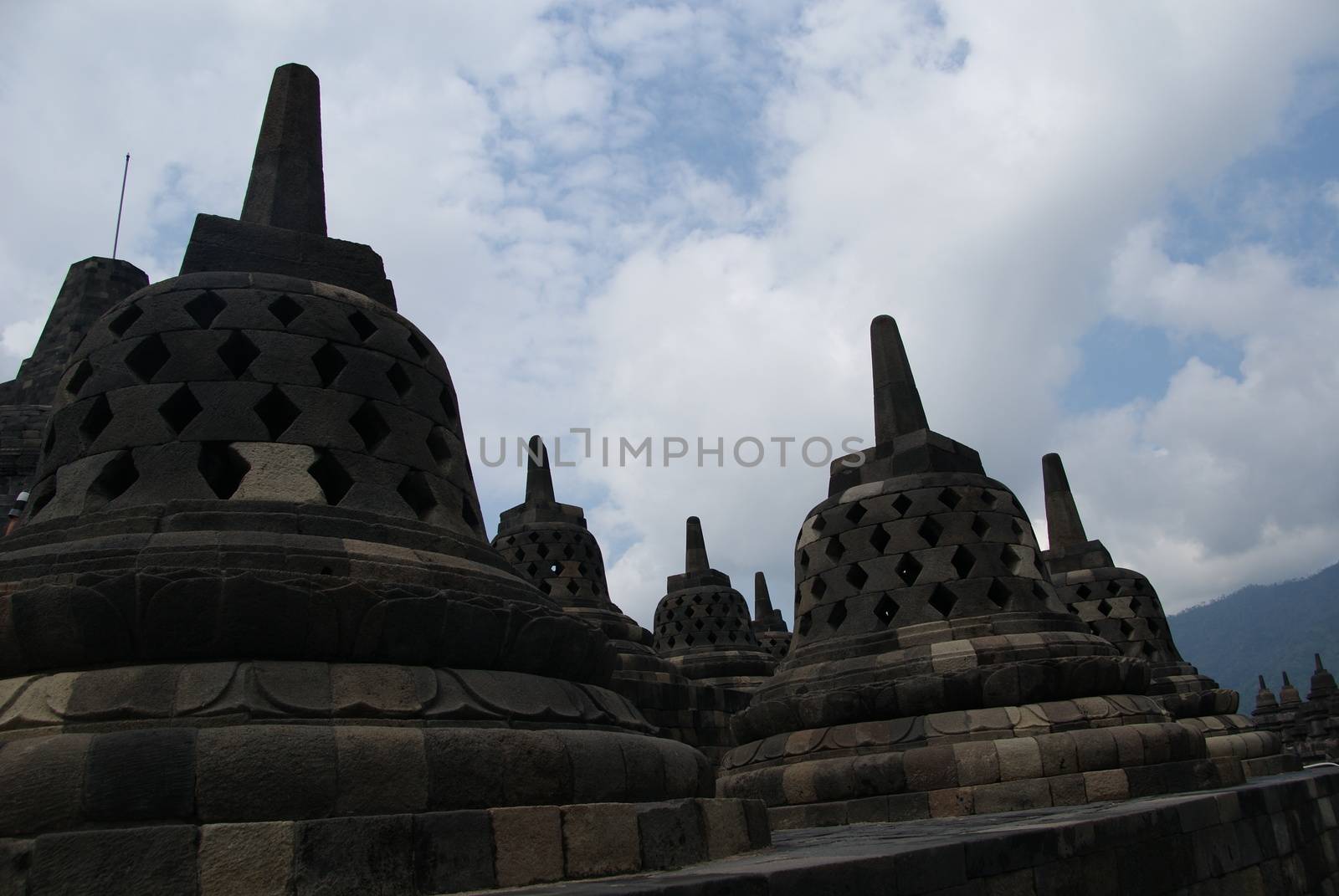 Around the circular platforms are 72 openwork stupas, each containing a statue of the Buddha.