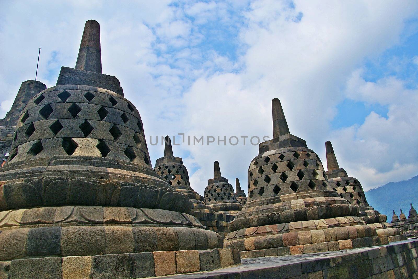 Around the circular platforms are 72 openwork stupas, each containing a statue of the Buddha. by craigansibin