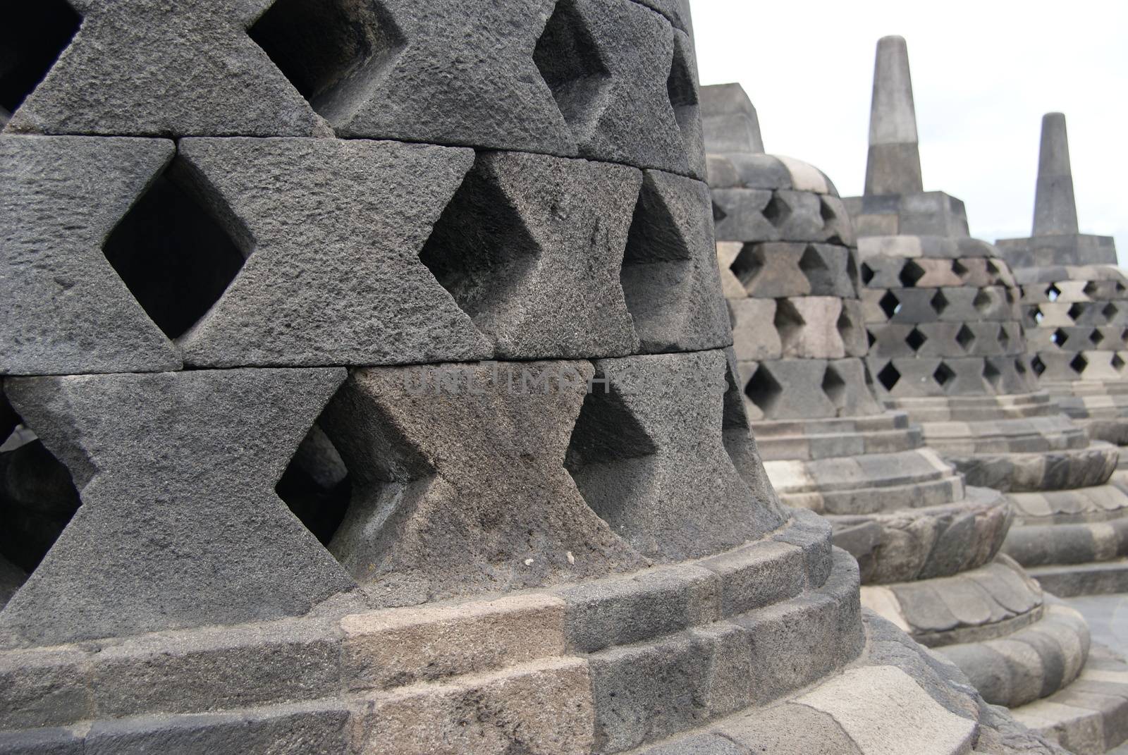 Around the circular platforms are 72 openwork stupas, each containing a statue of the Buddha. by craigansibin