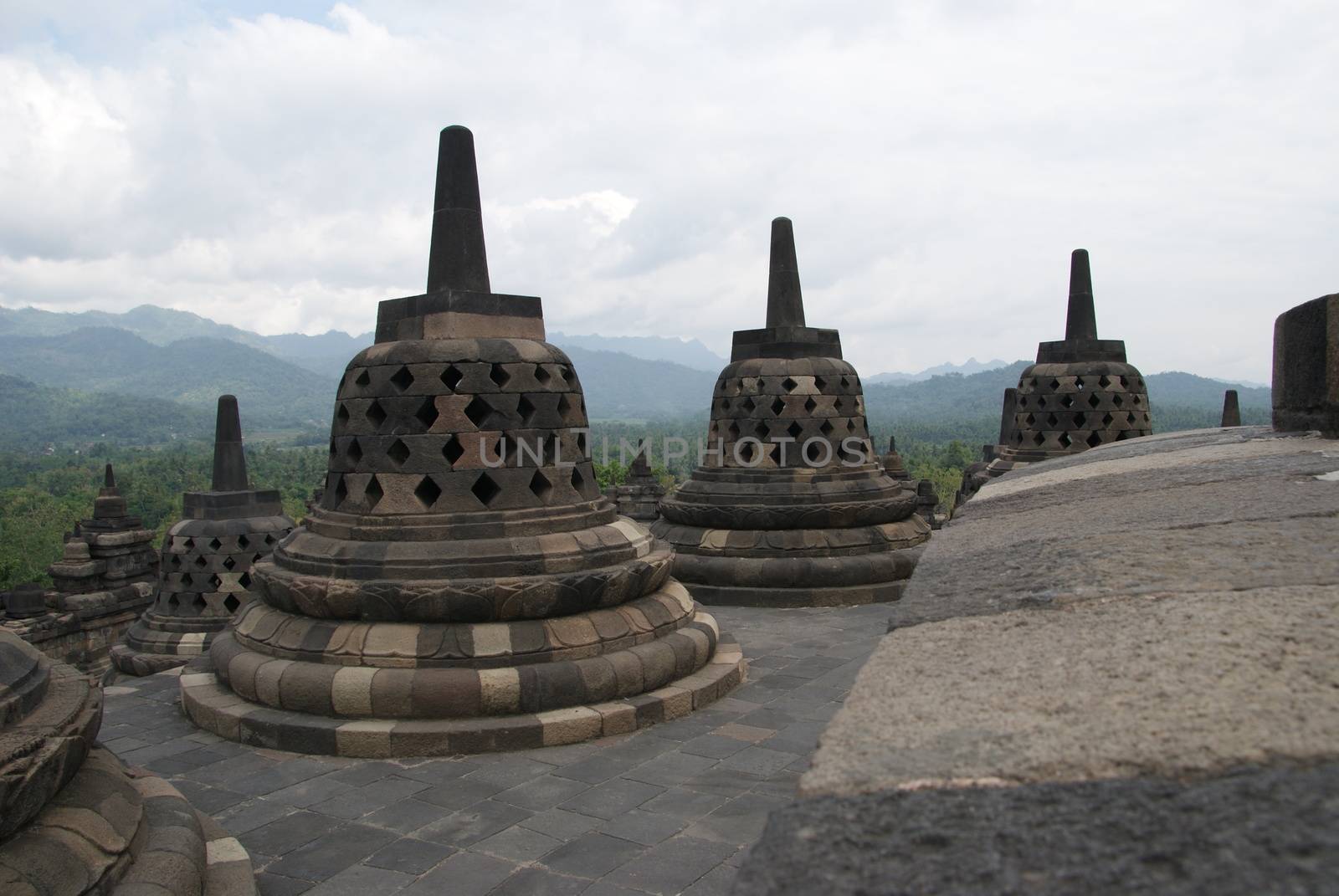 Around the circular platforms are 72 openwork stupas, each containing a statue of the Buddha. by craigansibin