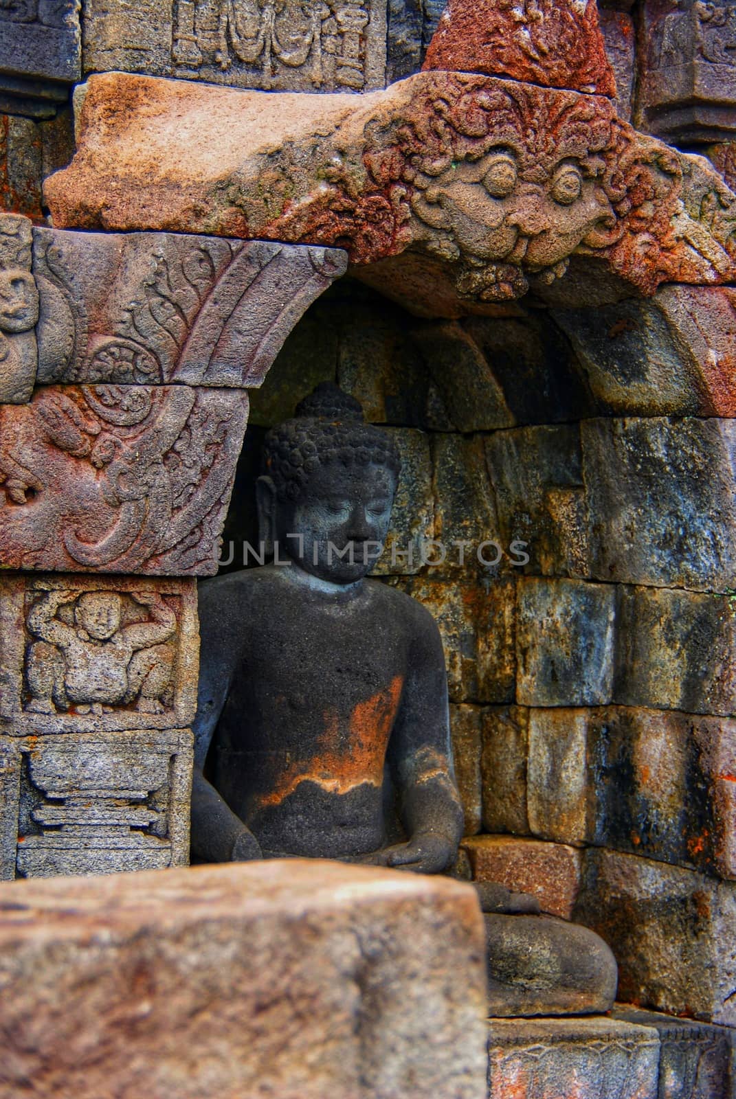 Image of sitting Buddha in Borobudur Temple, Jogjakarta, Indonesia by craigansibin