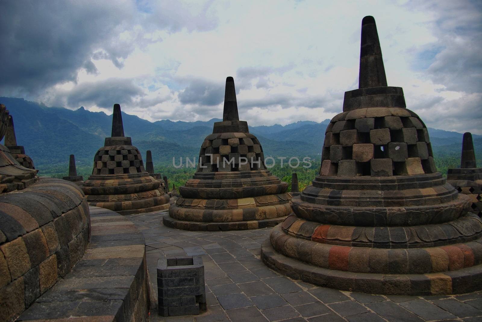 Around the circular platforms are 72 openwork stupas, each containing a statue of the Buddha. by craigansibin