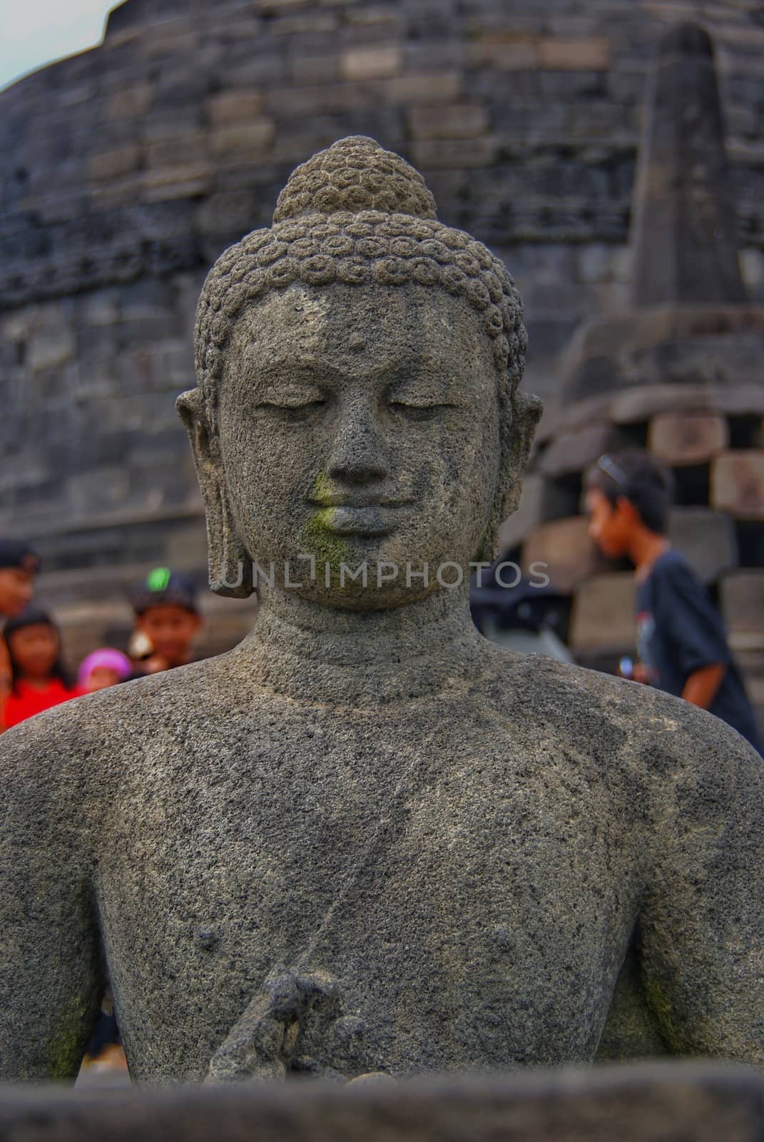 Image of sitting Buddha in Borobudur Temple, Jogjakarta, Indonesia by craigansibin