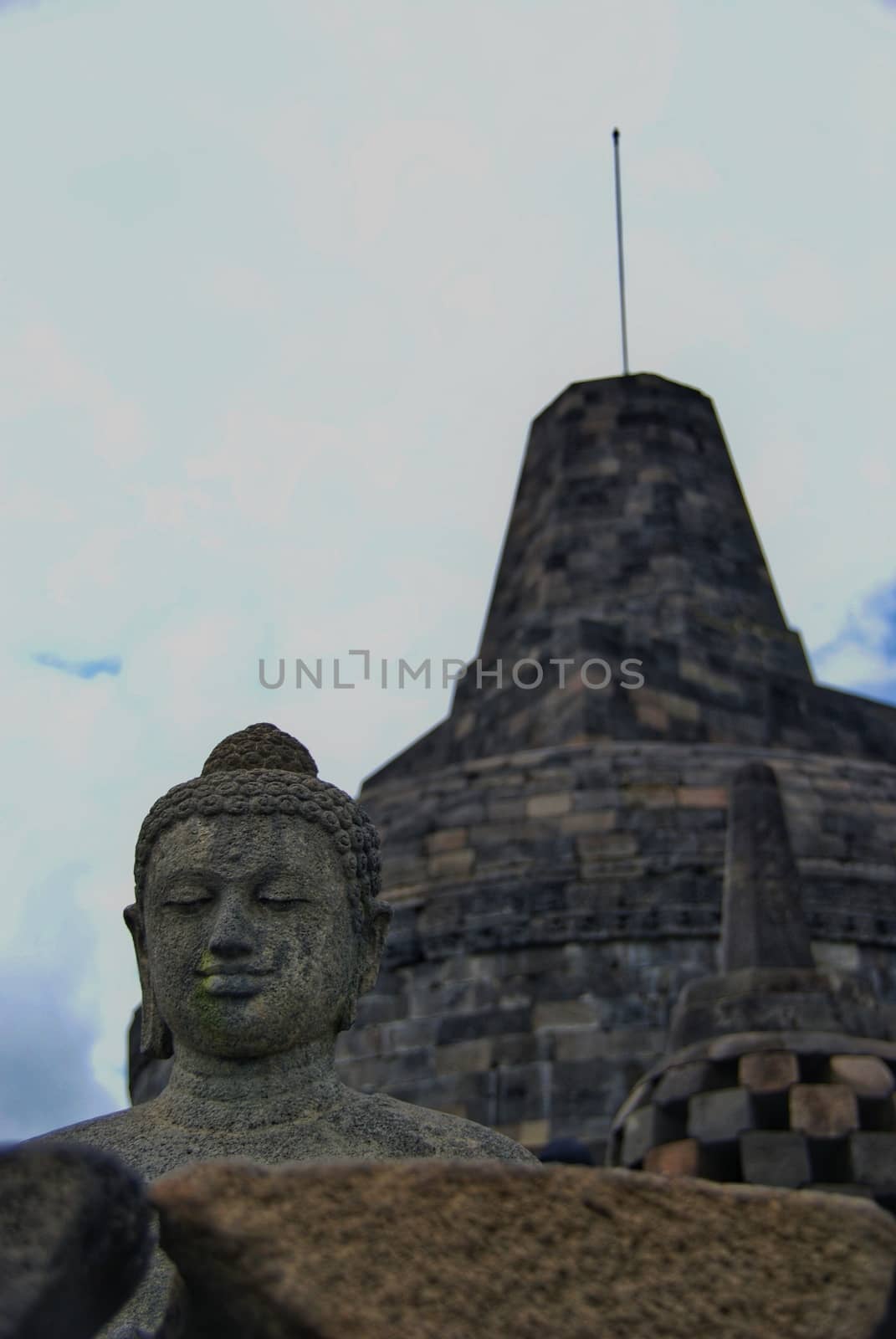 Image of sitting Buddha in Borobudur Temple, Jogjakarta, Indonesia by craigansibin