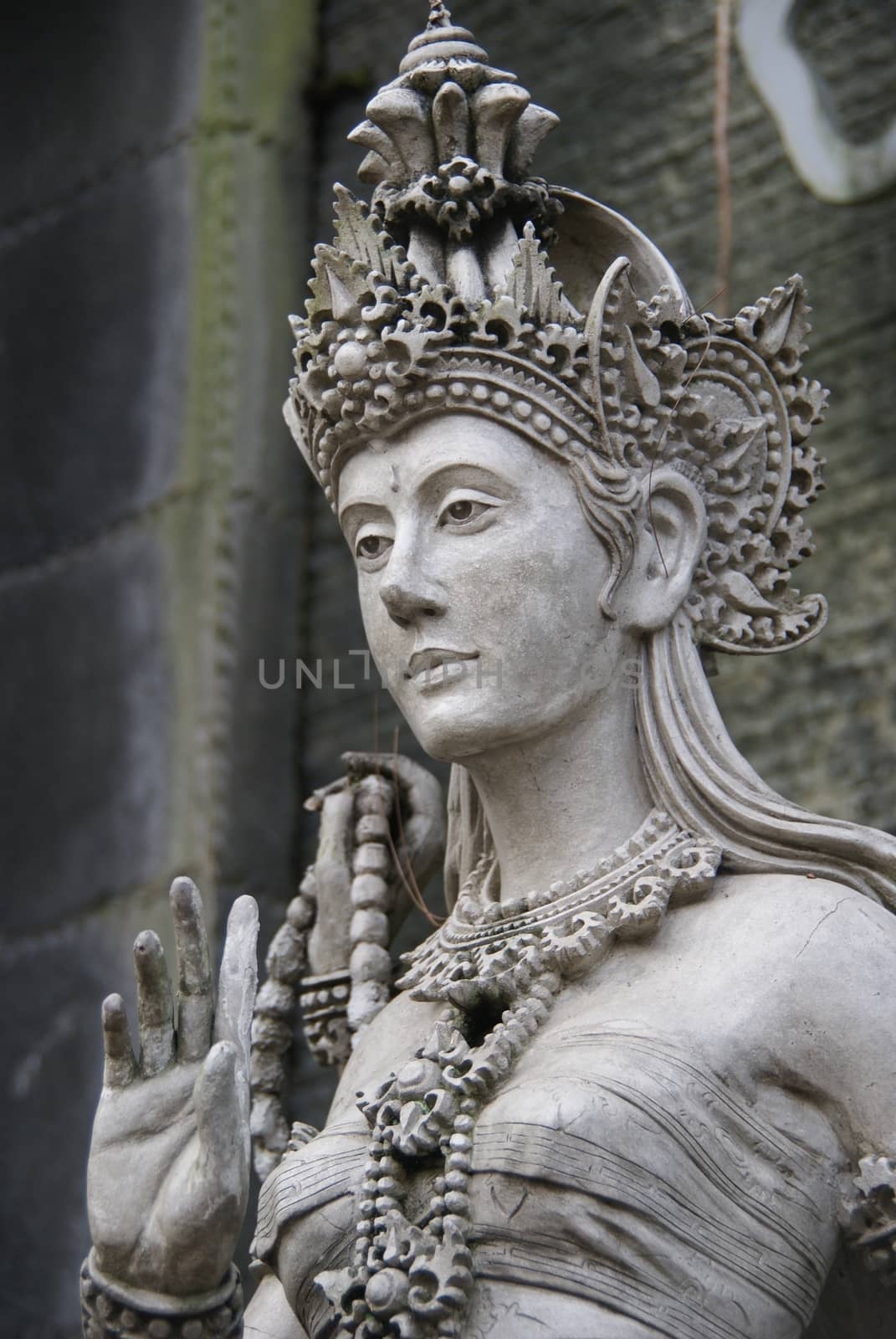 beautiful marble of women statue in traditional indonesian attire by craigansibin