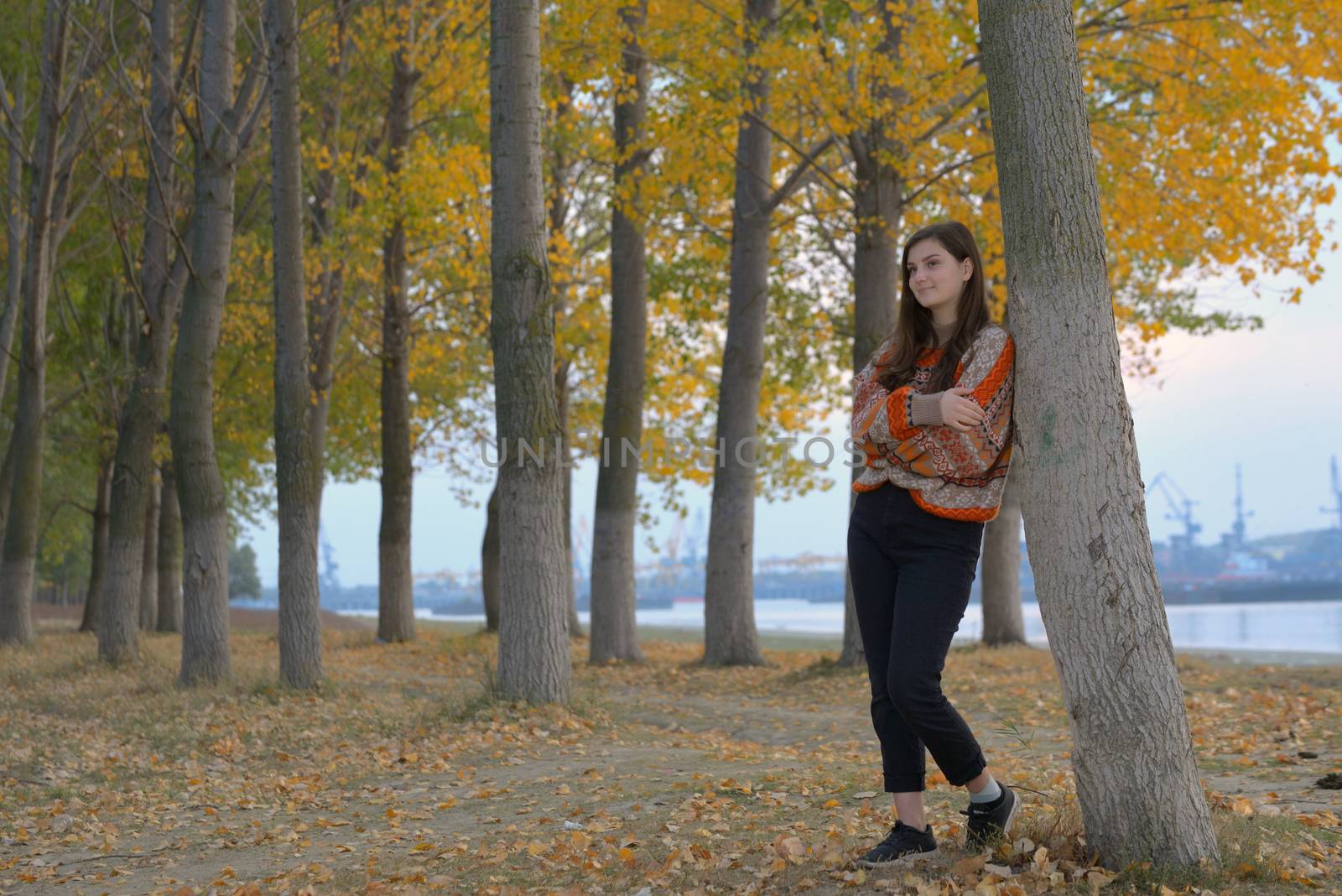 Portrait of a teen girl in autumn forest