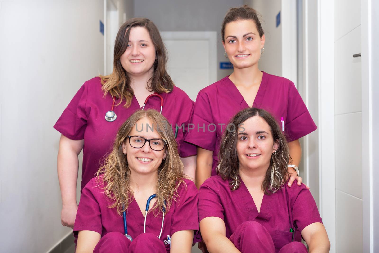 Cheerful woman veterinary team by HERRAEZ
