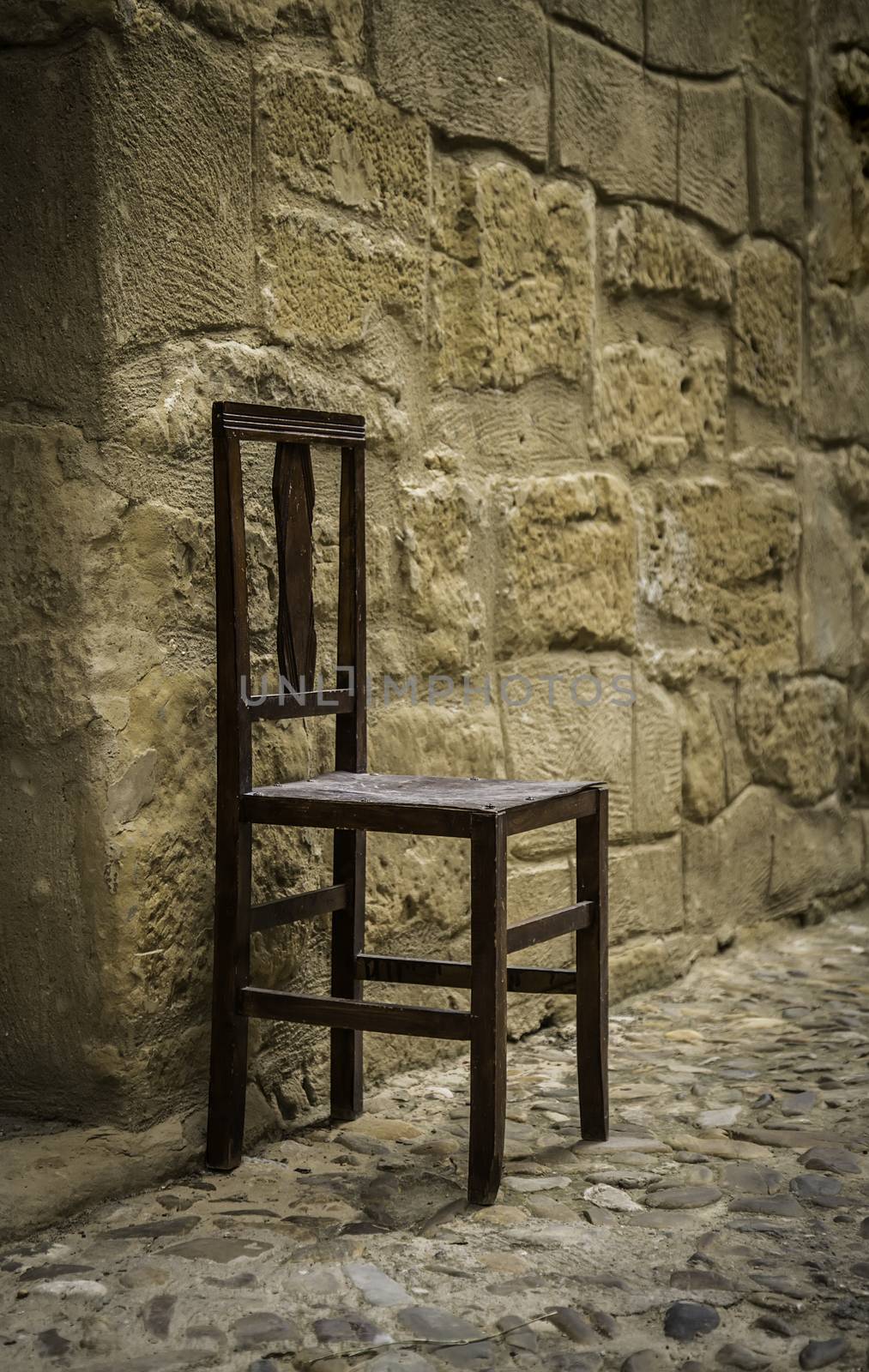 Old wooden chair, detail of relaxation and rest