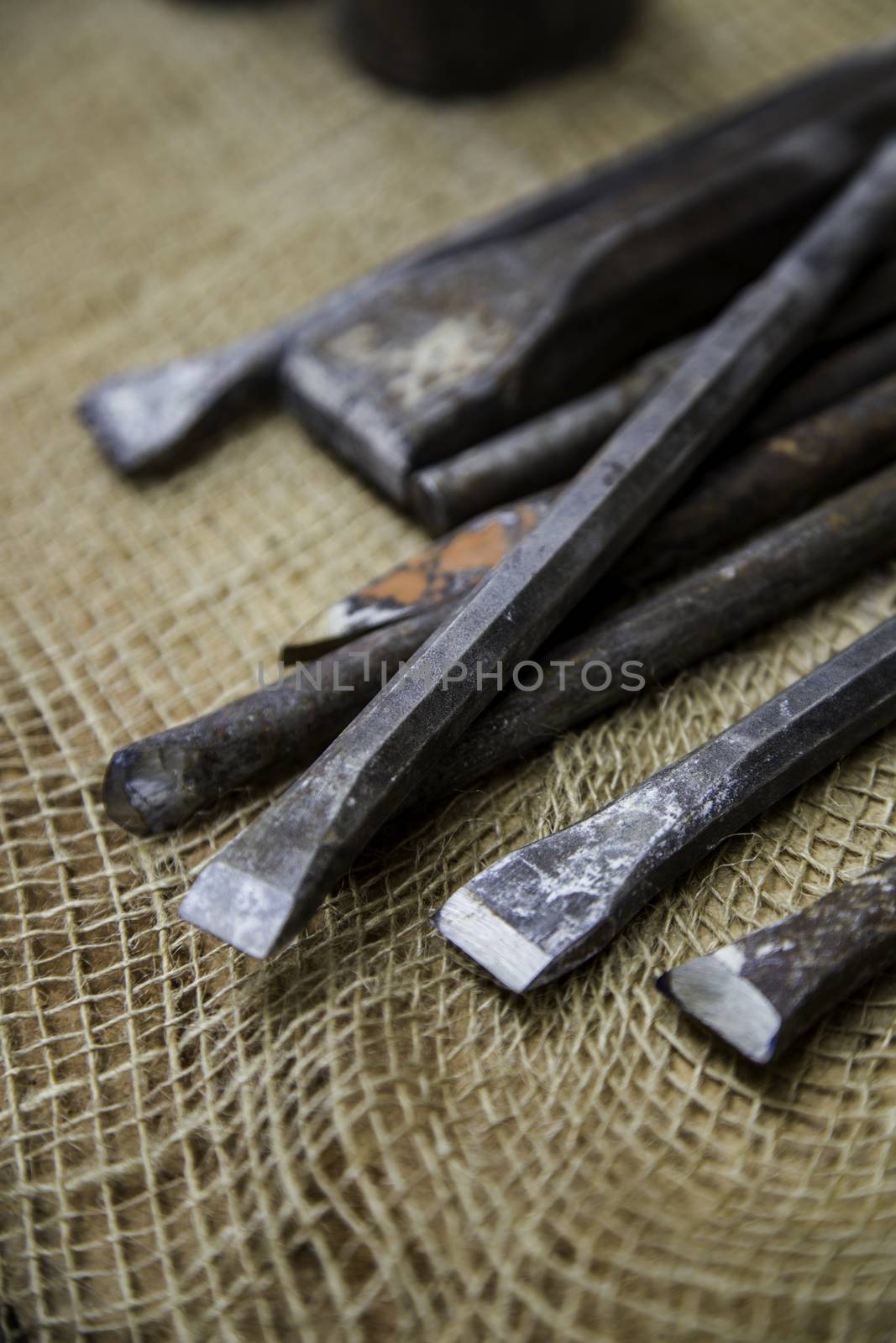 Old tools for carving stone of handmade way, detail of old manual craft