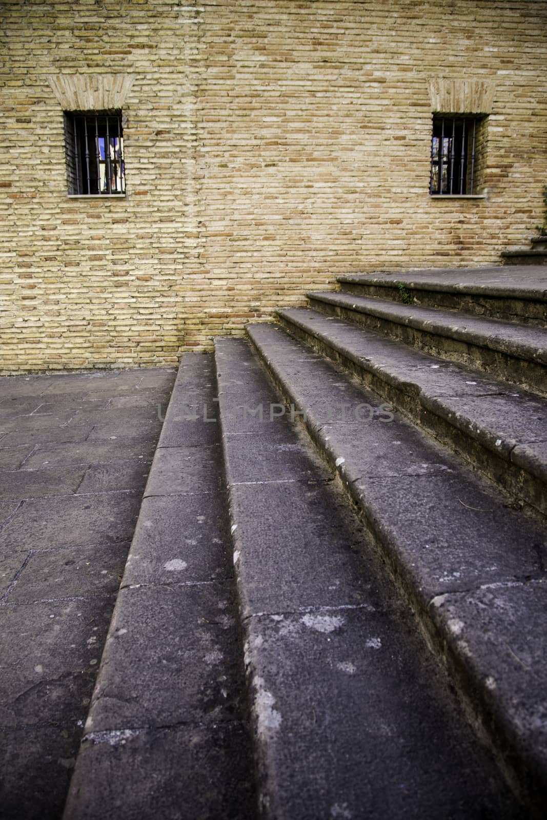 Staircase with window detail of old stone stairs, textured background, ancient architecture