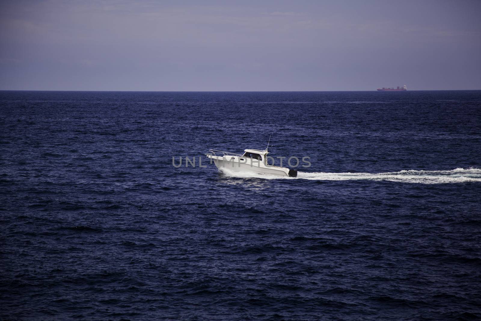 Boats in the distance, detail of boats on the high seas