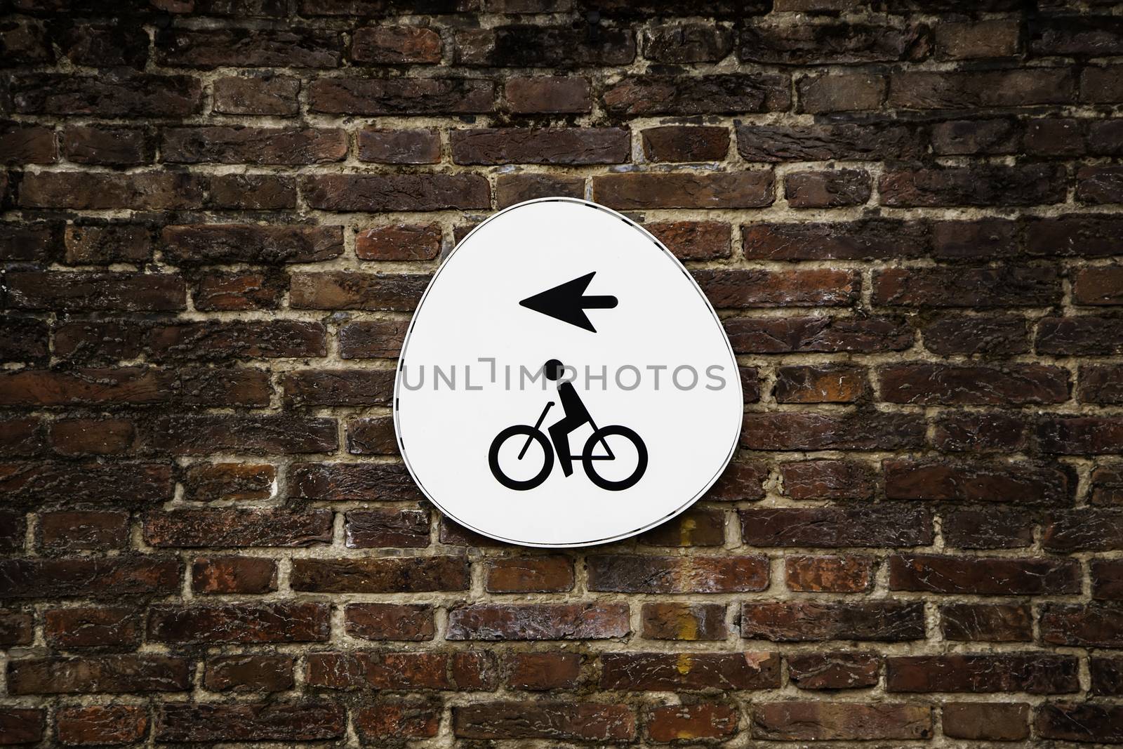 Bicycle sign with arrow, detail of information, transport