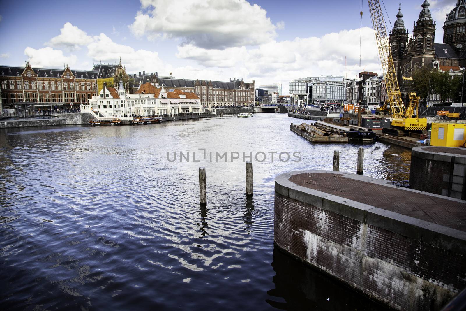 AMSTERDAM, NETHERLAND - SEPTEMBER 06, 2018, Central station building. The building of the Central station is one of the architectural attractions of the city, Netherland on September 06, 2018 by esebene