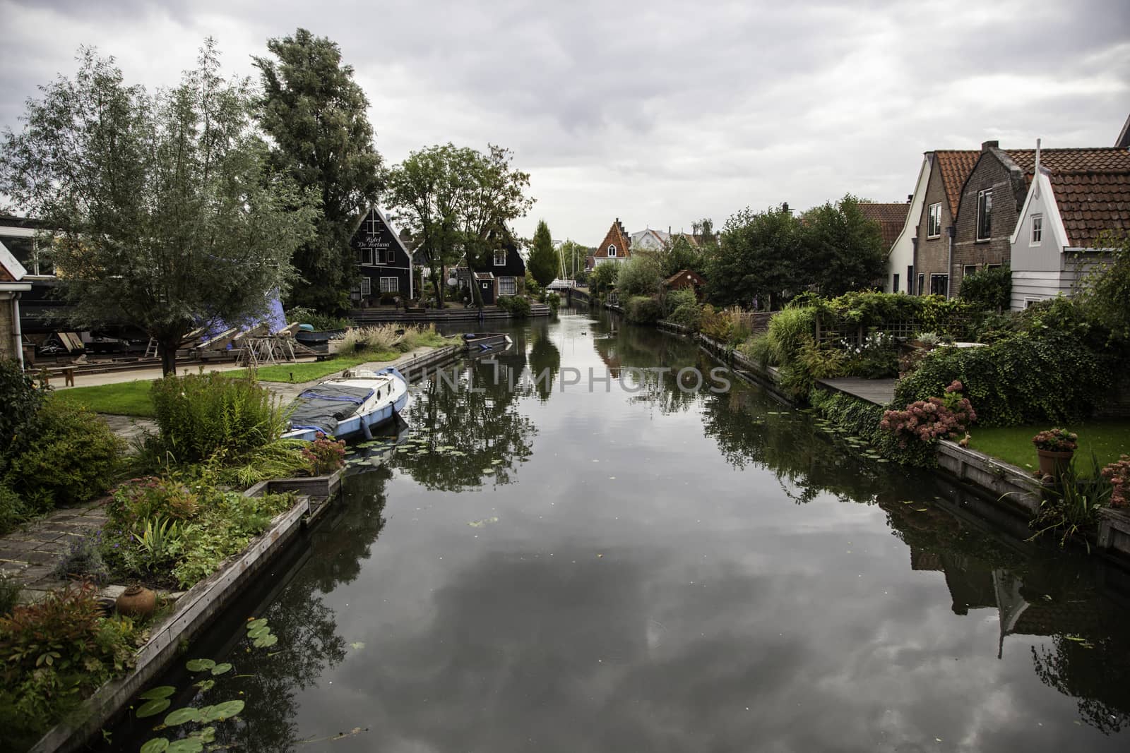 Medieval channels of Bruges, detail of tourism in a city of Belgium