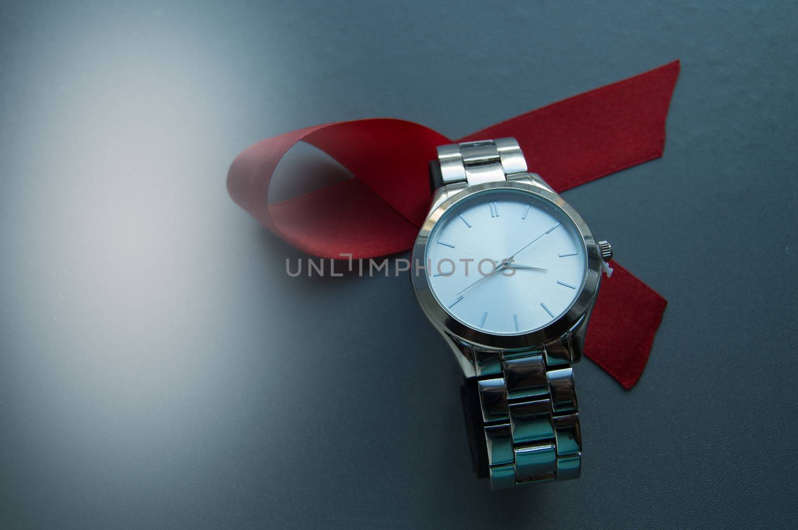World AIDS day, the symbol of the red ribbon and the clock - do not waste time to start treatment by claire_lucia