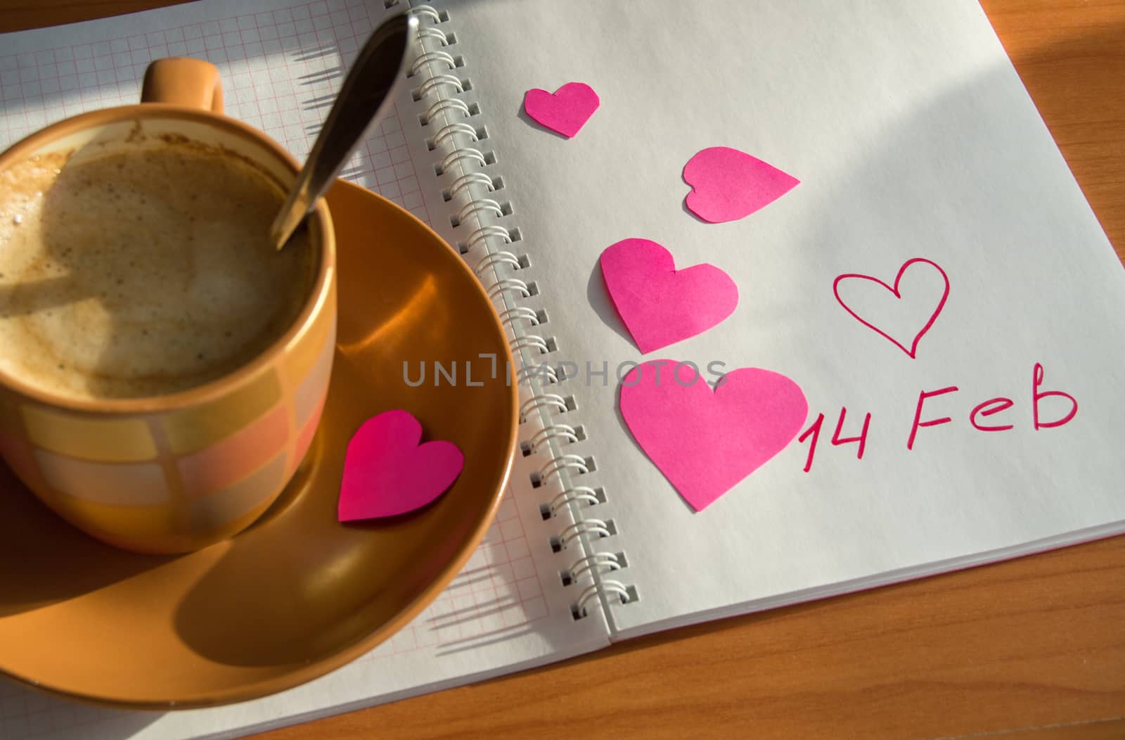 Preparation for Valentine's Day: the notebook and hearts, Cup of coffee, close-up by claire_lucia