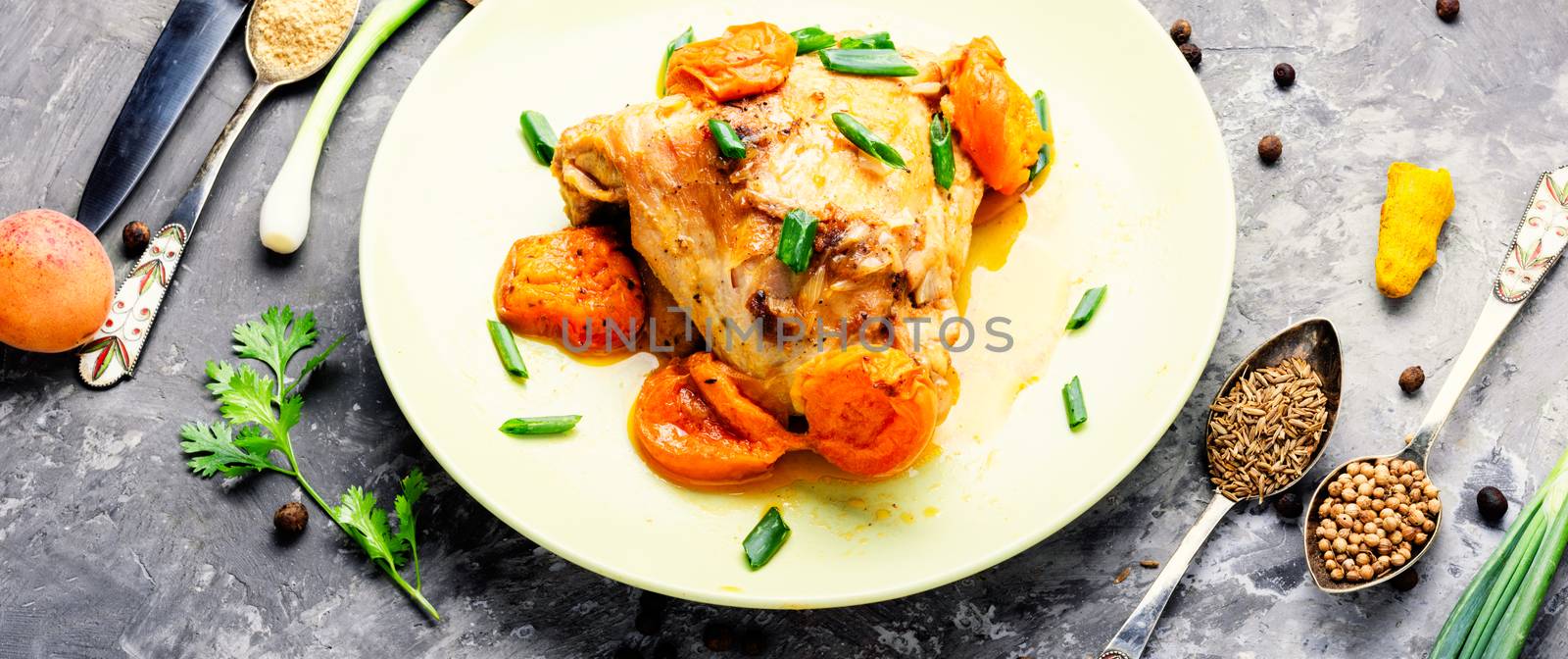 Chicken stewed in apricot sauce. Summer meat dish