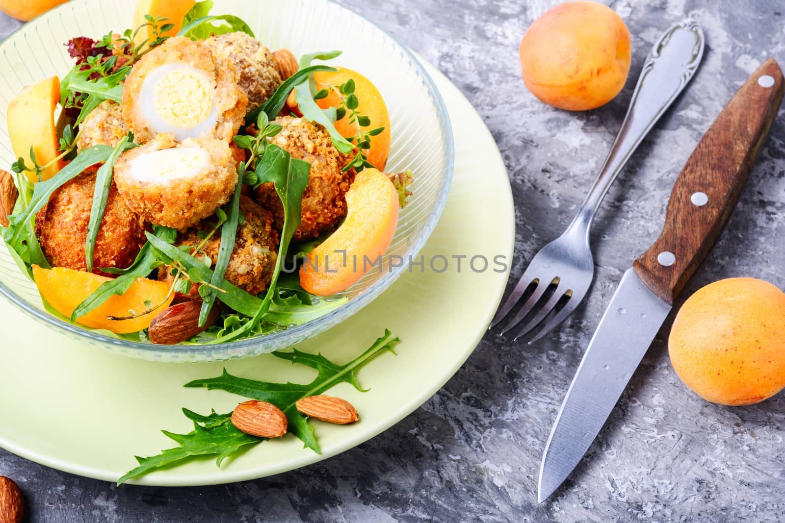 Summer salad with apricot, egg and greens.Healthy food