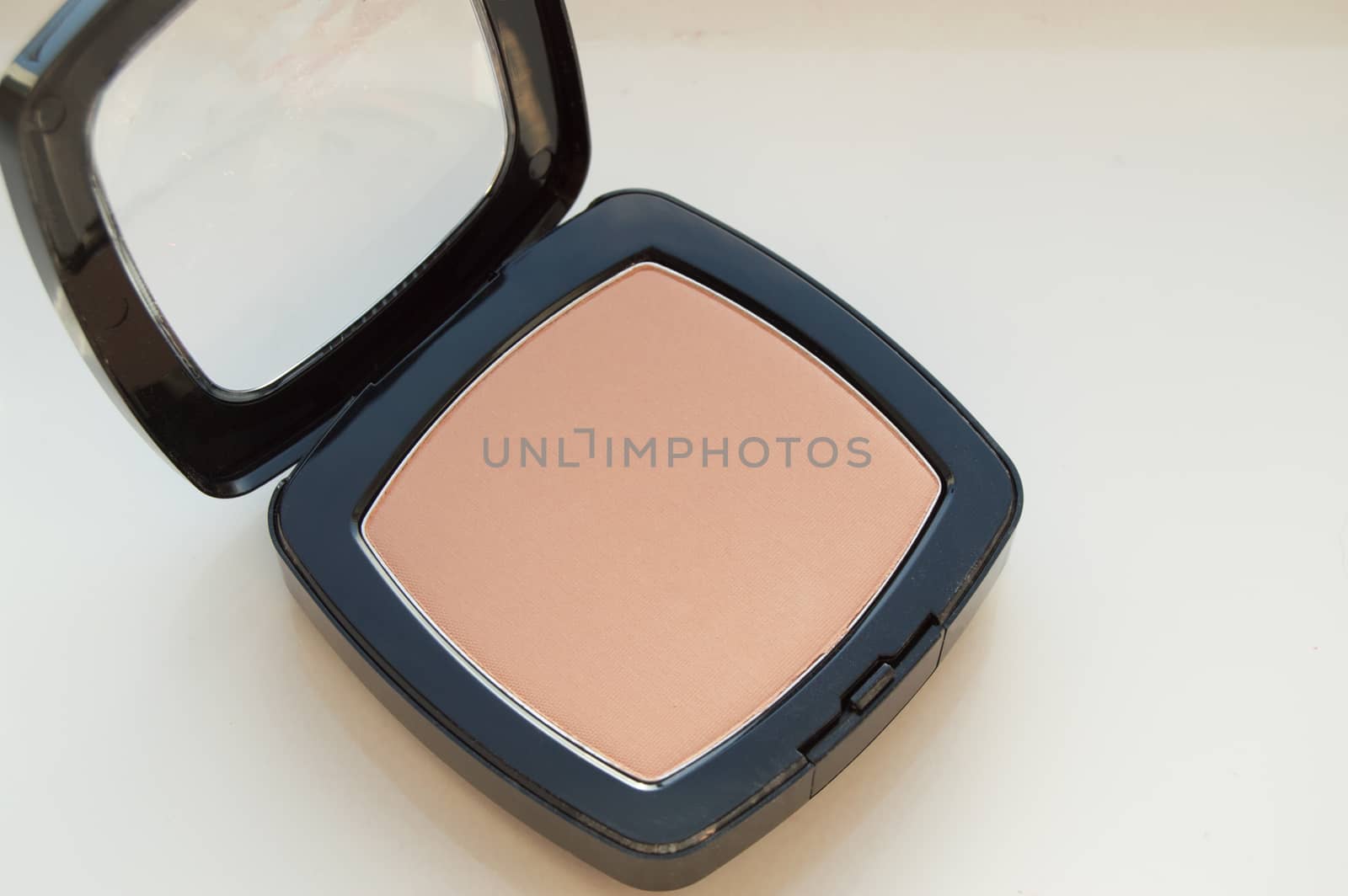 Compact powder makeup, on white background, top view by claire_lucia