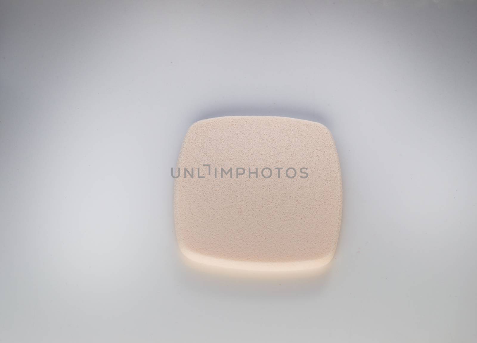 Cosmetic sponge for make up on white background, top view by claire_lucia