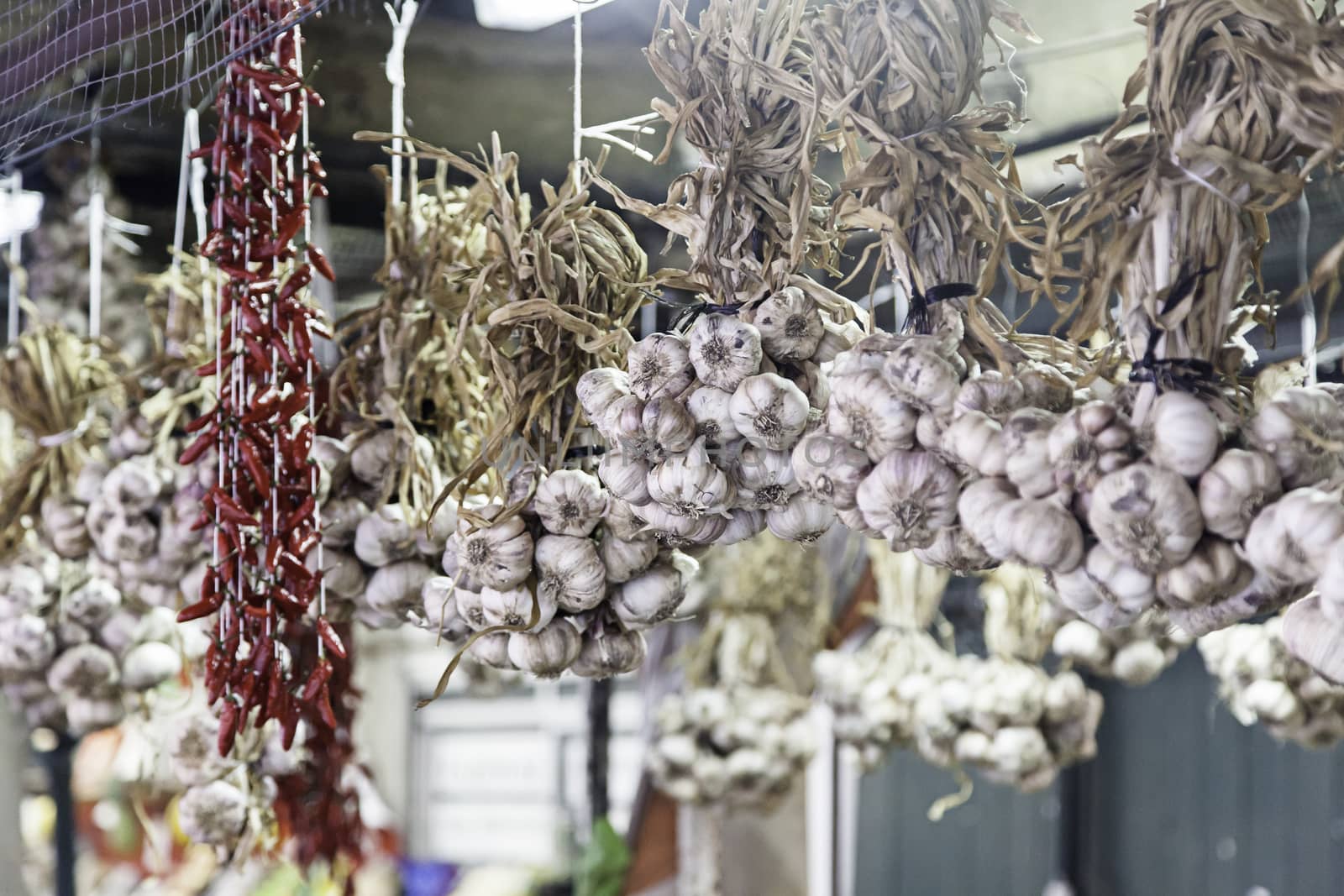 Fresh garlic on a market, detail of raw vegetables